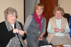 Margaret Stewart, centre, a helper at the Open Door Club with Mona and Molly Rainey who are learning to crochet.